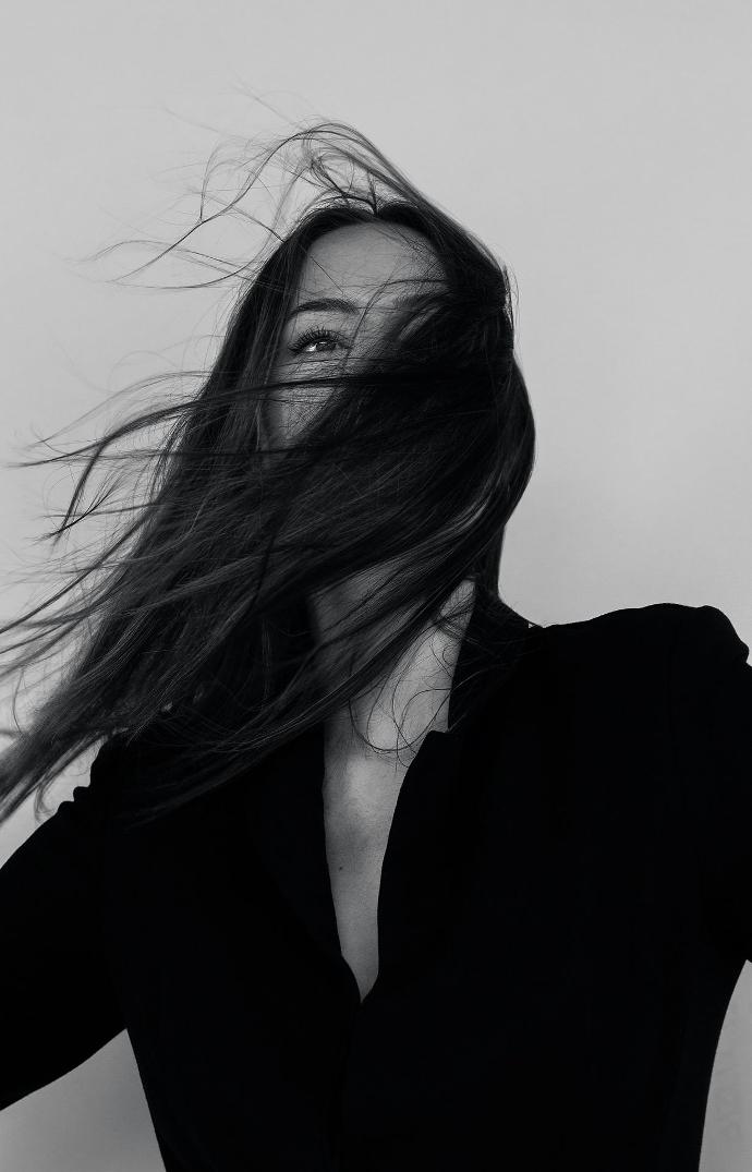 Black and white image of a woman with fine hair